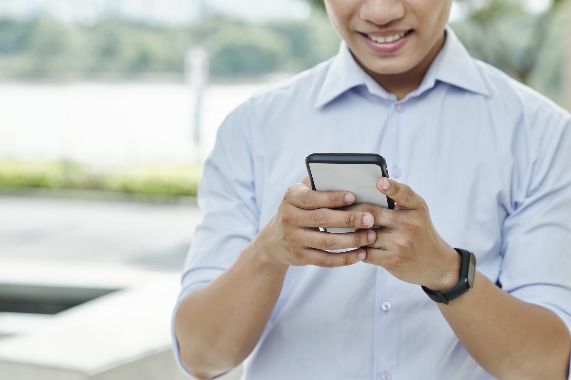 businessman-checking-phone businessman-checking-phone